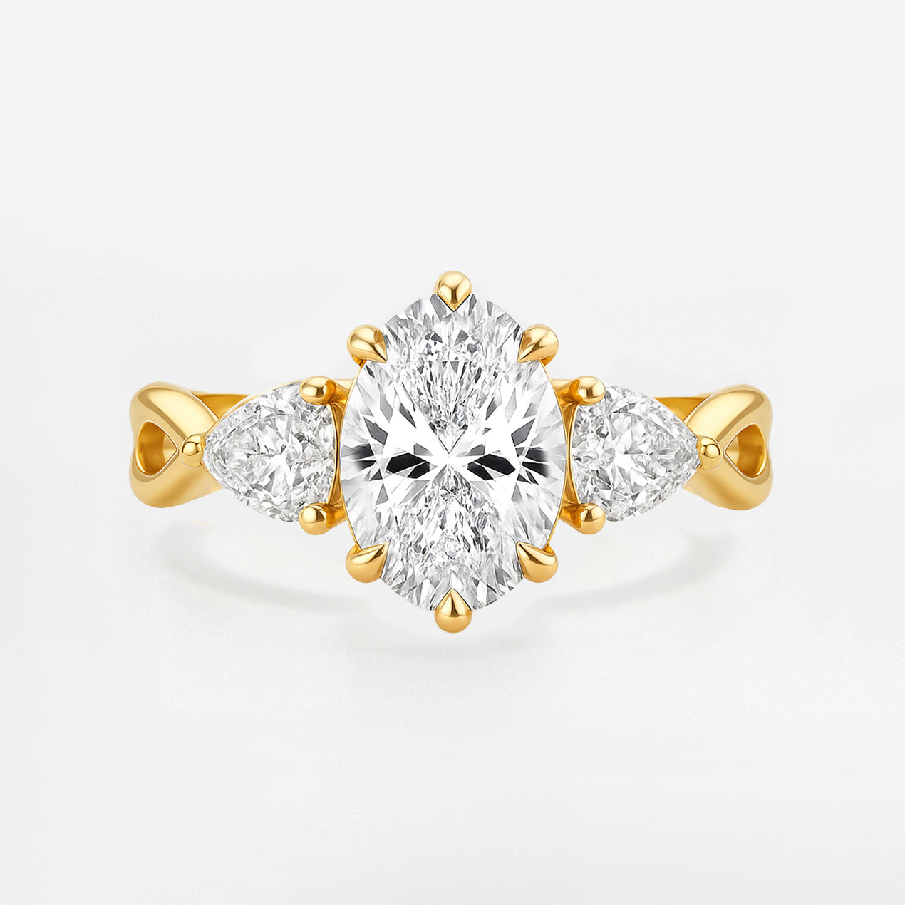 The Rebecca Ring - Oval Trilogy with Pear Side Stones