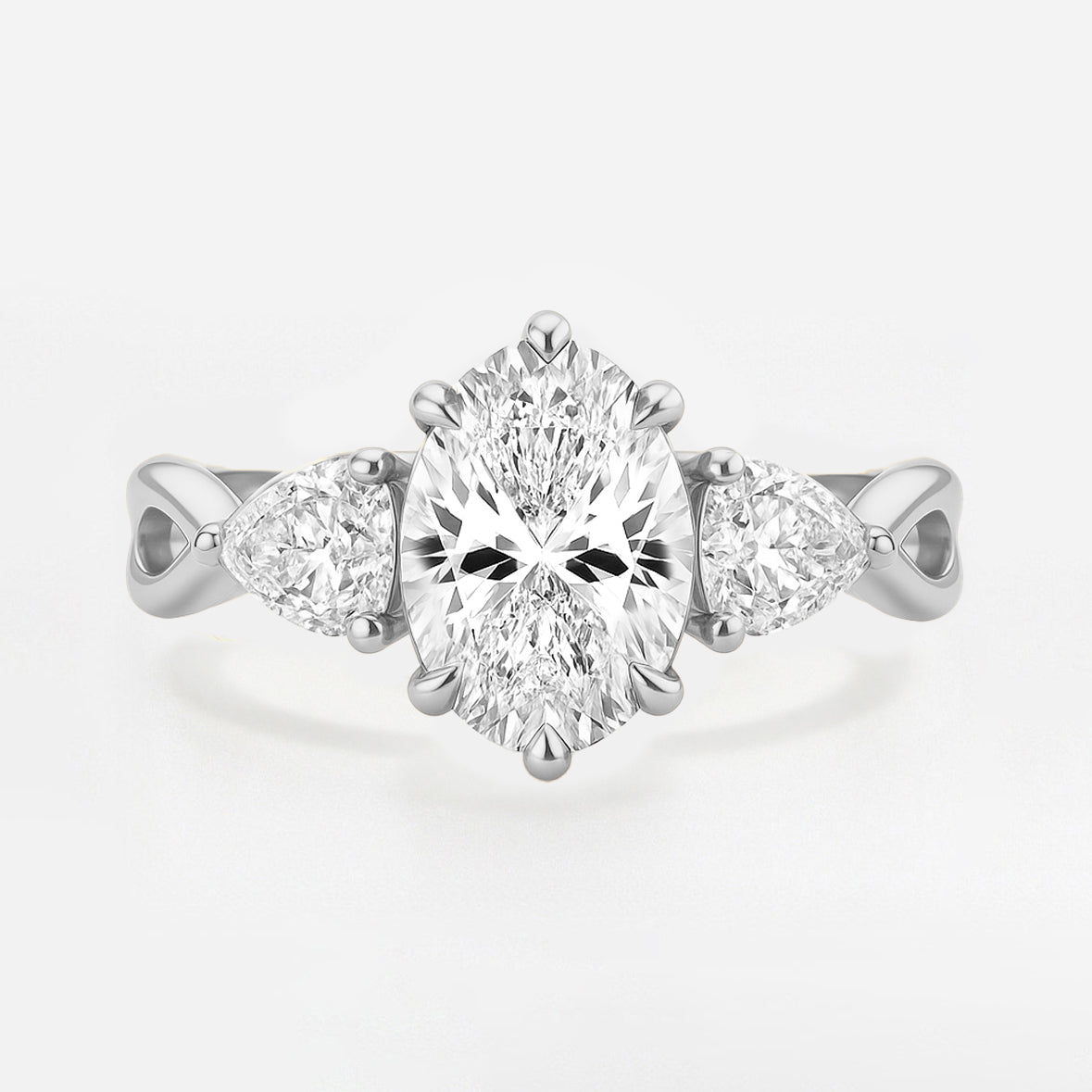 The Rebecca Ring - Oval Trilogy with Pear Side Stones