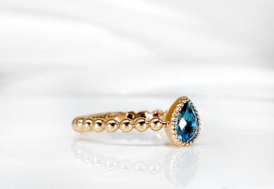Rose Gold Blue Topaz Ring