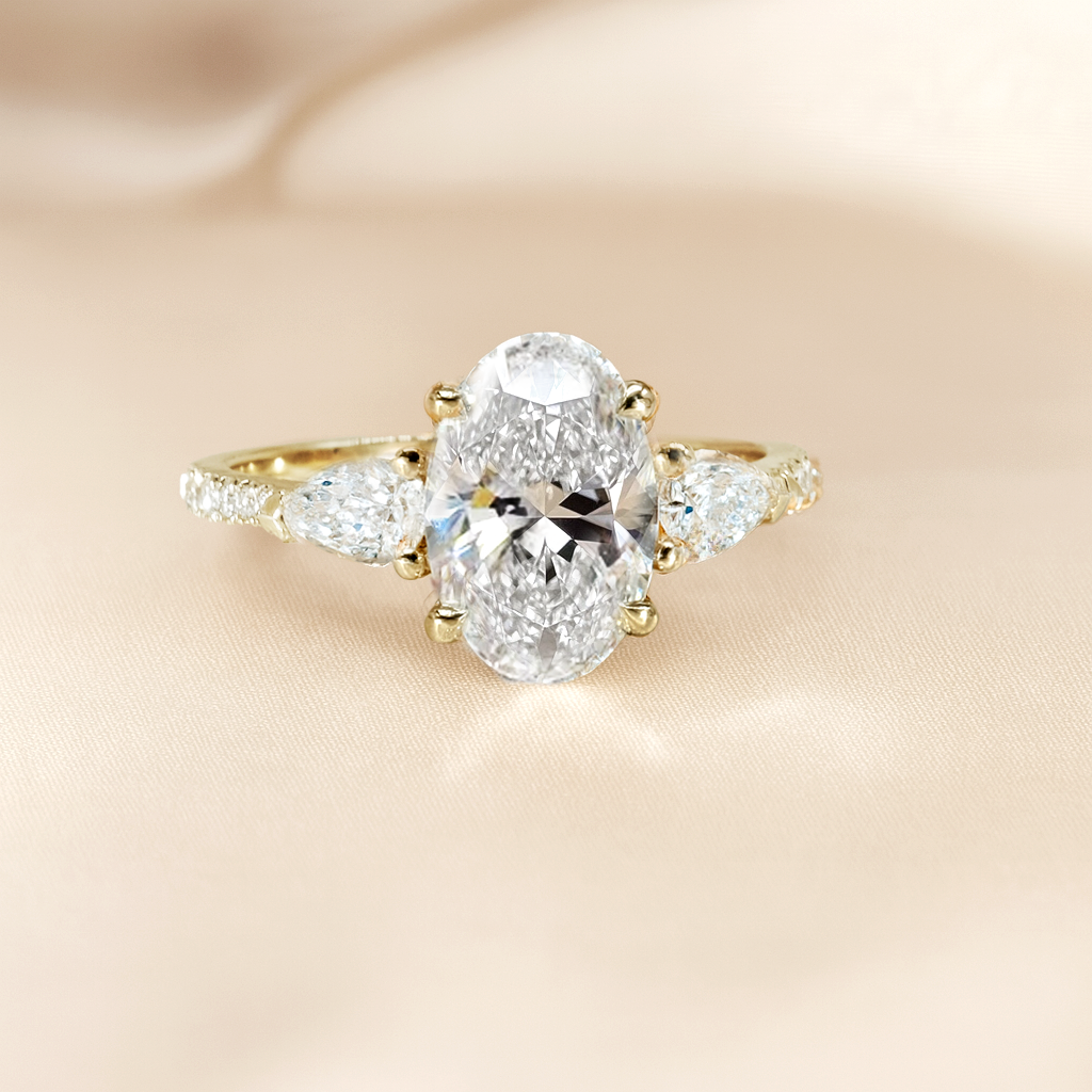 The Anastasia Ring - Trilogy with Pear Side Stones and Pavé Band