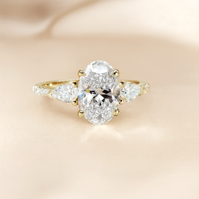 The Anastasia Ring - Trilogy with Pear Side Stones and Pavé Band