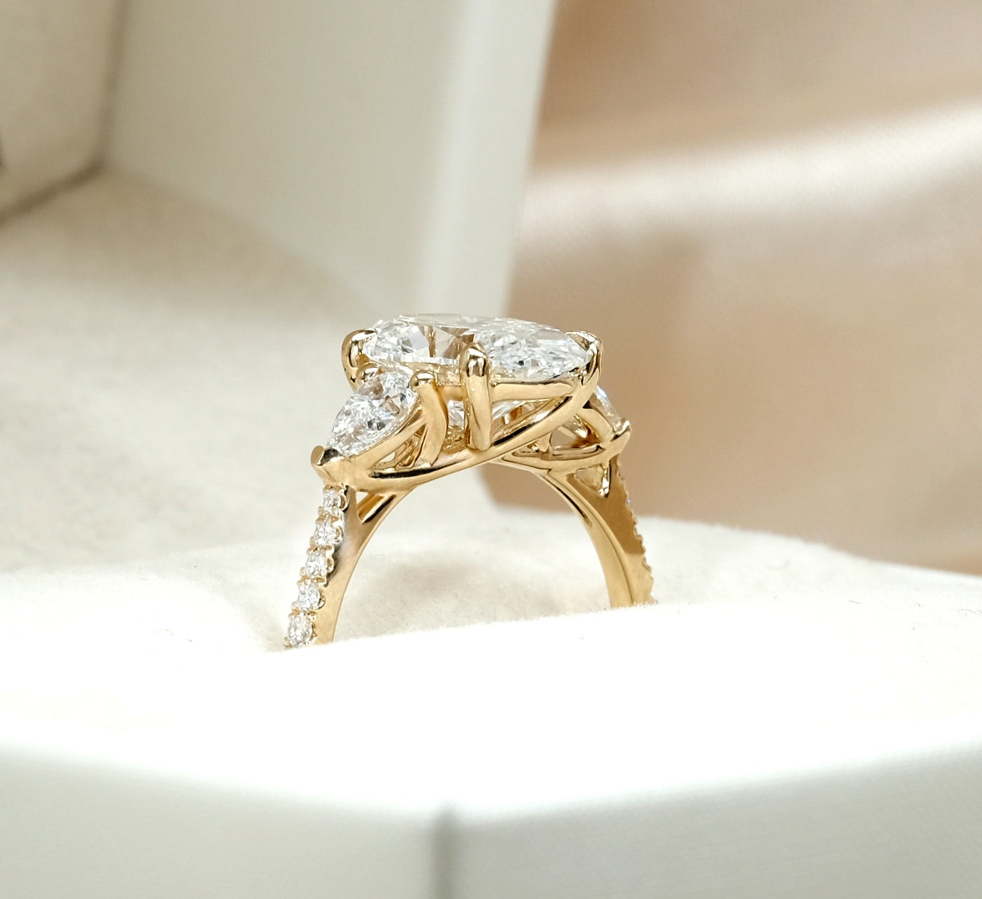 The Anastasia Ring - Trilogy with Pear Side Stones and Pavé Band
