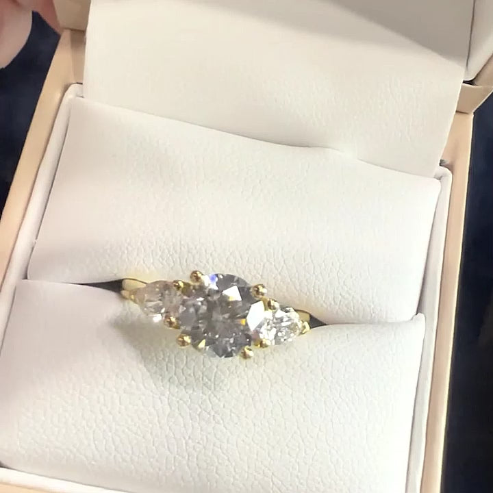 The Alexandra Ring - Round Trilogy with Pear Side Stones